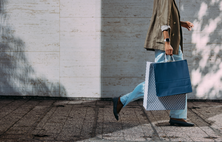 Person walking with shopping bags